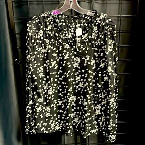 Brand new boutique blouse 100 % polyester. True to size.